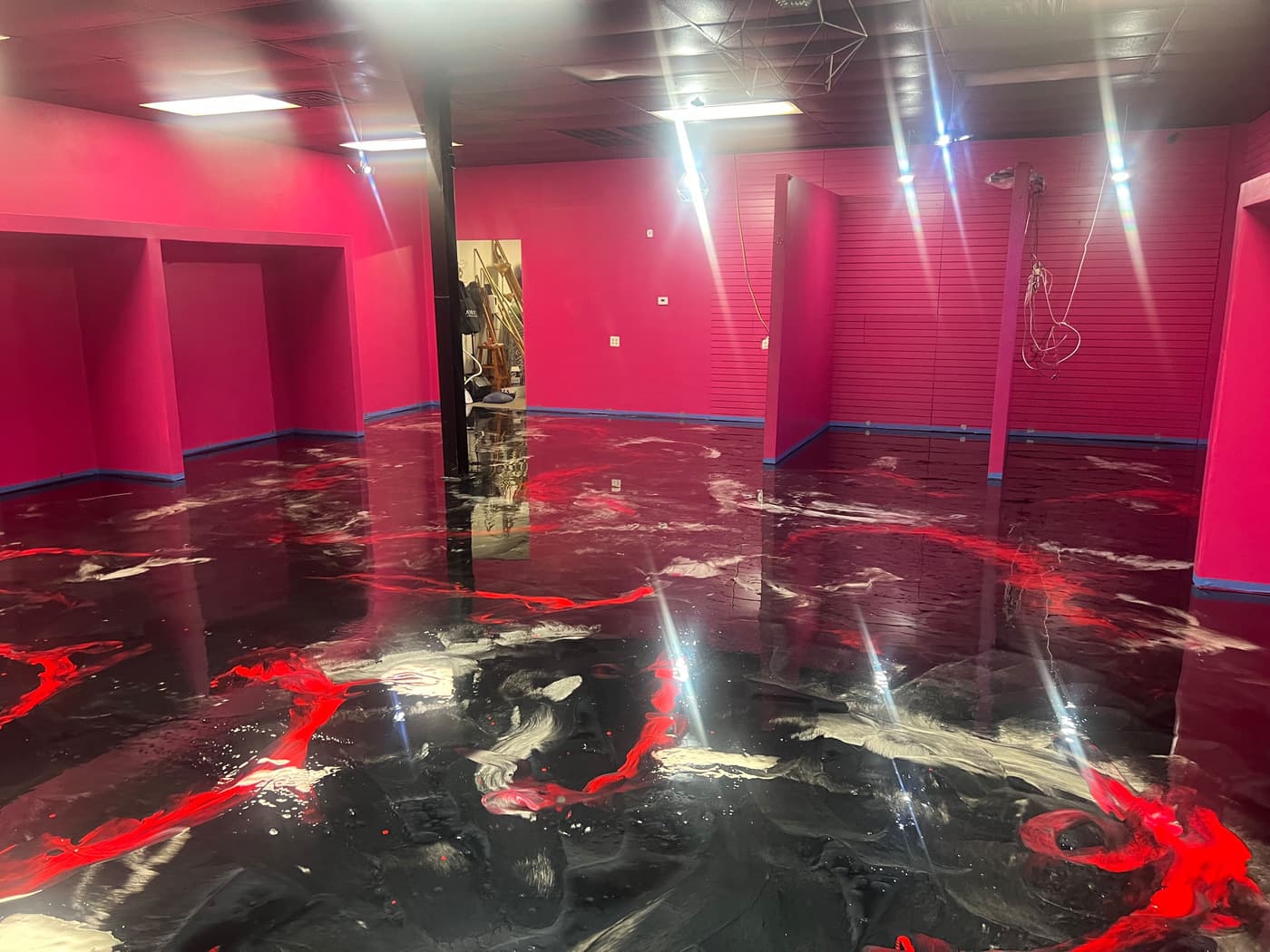 Dramatic red and black metallic epoxy floor